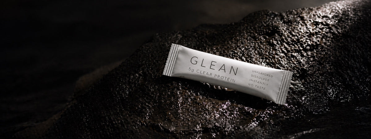 Glean stick pack on wet black stone